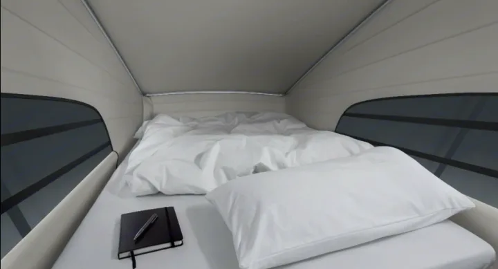 Cozy RV rental camper van bedroom: white bed with pillow & notebook. Ready for comfortable travel.. Mercedes Marco Polo 2022
