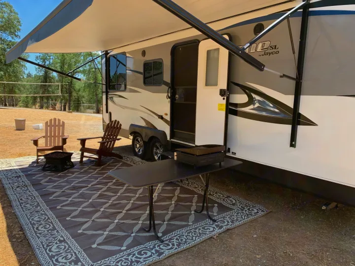 Outdoor rug, table, awning, fire pit. . Jayco Octane 2018
