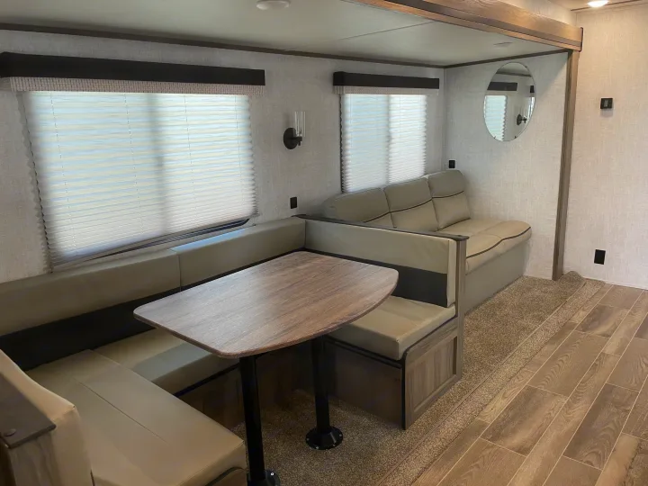 Large Dinette makes sleeping area and pull out sofa. Gulf Stream Conquest 2021