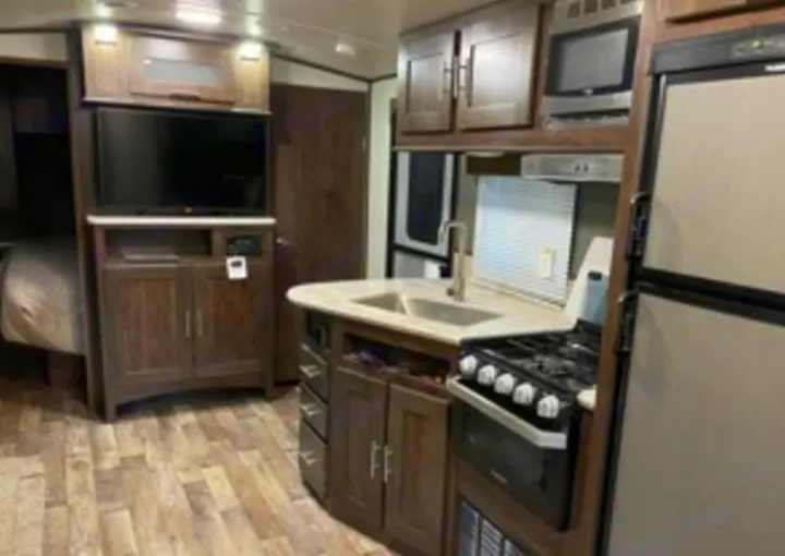 Explore this RV rental interior: a full kitchen, entertainment center, and sleeping area provide a comfortable home on wheels.. Cruiser RV Embrace Ultra Lite 2019