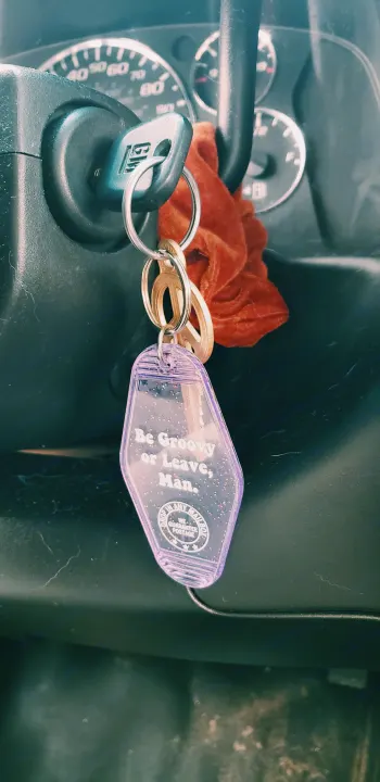 Road trip ready! Car key in ignition with a 'Be Groovy' keychain and peace sign. Perfect for an rv rental adventure.. Chevrolet Express 2018