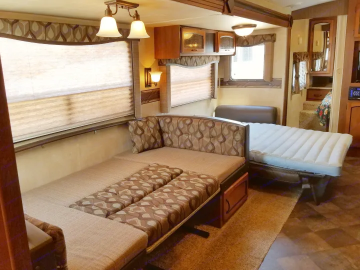 Dining room/ Living room converted to sleeping quarters. Fold out bed has an air mattress built in! . Keystone RV Springdale 2013