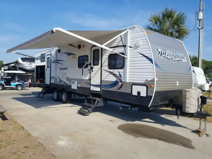 Electric awning provides plenty of shade! Easy to use.. Keystone RV Springdale 2013