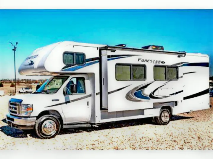 White Forester Class C RV for rv rental, parked on gravel under clear sky, ready for camping adventures.. Forest River Forester 2020