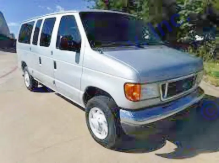 This silver passenger van is ideal for an RV rental adventure. A spacious vehicle, perfect for your next group road trip.. Ford E350 2005