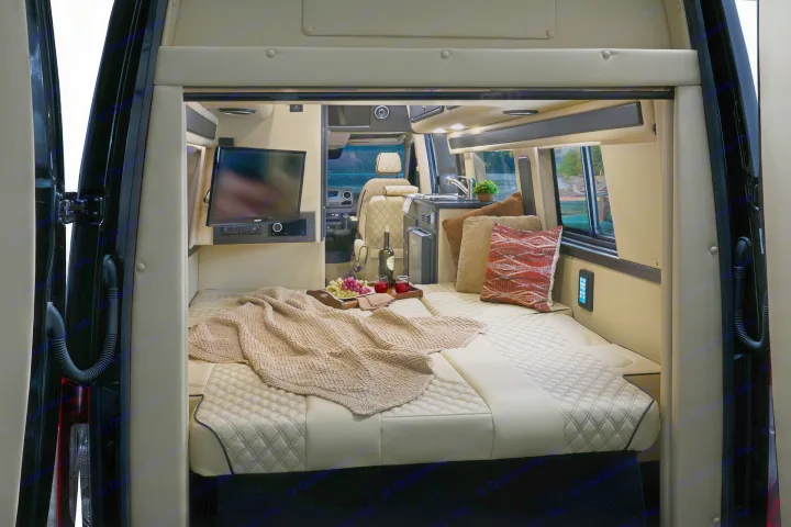 This luxurious RV rental features a comfortable bed, TV, kitchenette, and a scenic view for ultimate relaxation on the road.. Midwest Automotive Designs Midwest Automotive Designs Class B 2020