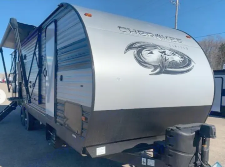 Front and side view of a modern silver and black Cherokee Limited travel trailer RV, ideal for rv rental.. Forest River Cherokee 2021