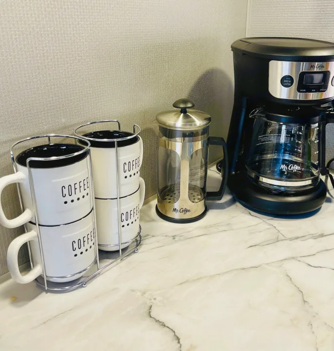 Compact coffee station with Mr. Coffee drip maker, French press, and mugs for your rv rental kitchen.. Dutchmen Aspen Trail 2022