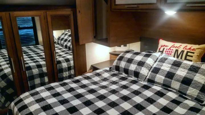 Queen bed, with added memory foam, thick mattress pad, protective cover and additional mattress pad, pillow covers, sheet set, blanket and duvet.. Keystone RV Cougar 2020