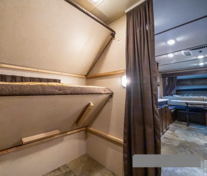RV rental's interior reveals versatile bunk beds and a bright, inviting main cabin space.. Jayco Jay Feather Ultra Lite 2015