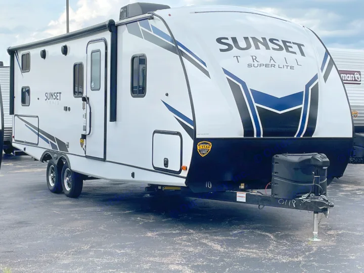 A new white Sunset Trail Super Lite travel trailer, with black and blue accents, perfect for an RV rental getaway.. Crossroads Sunset trail 242HB 2022