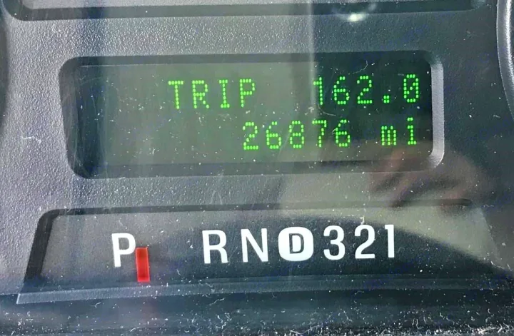 RV rental dashboard: Digital display shows odometer 26,876 mi, trip 162.0, and gear selector in Park.. Forest River Other 2011