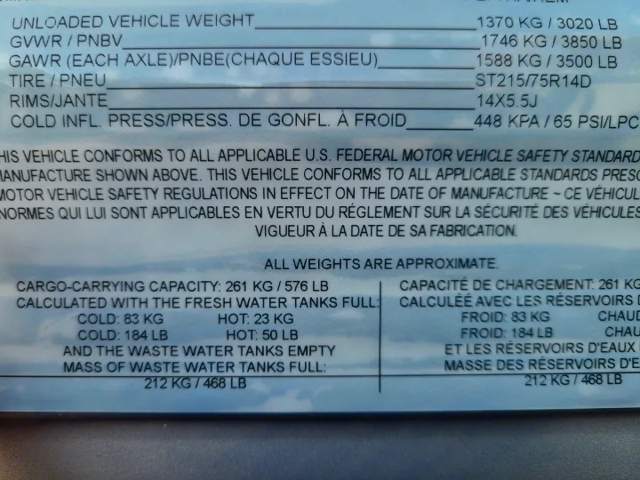 RV rental specifications label showing vehicle weight, tire data, and cargo capacity for safe loading.. Coleman Latern 17b 2022