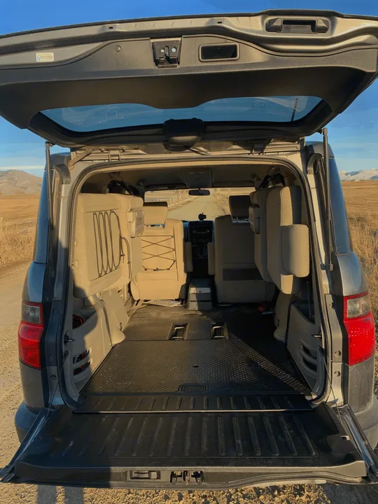 Backseats fold to side for extra storage/sleeping space. Honda Element 2009