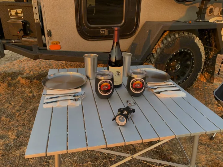 Enjoying an outdoor dinner set up next to an RV rental. Perfect for camping adventures with your Utah Teardrop trailer.. Little Guy Silver Shadow 2015