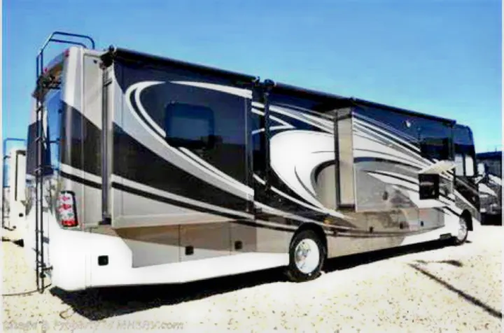 Sleek black, white, & silver luxury motorhome RV rental parked with slide-outs extended, ready for vacation travel.. Thor Challenger 2015