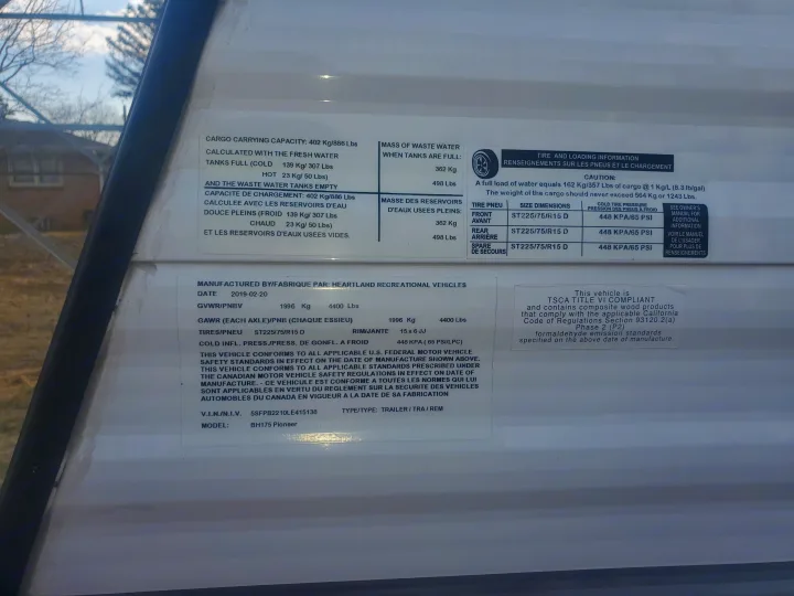 RV rental: Detailed compliance label of a Heartland BH175 Pioneer, with cargo, water, and tire specifications.. Heartland RVs Pioneer 2020