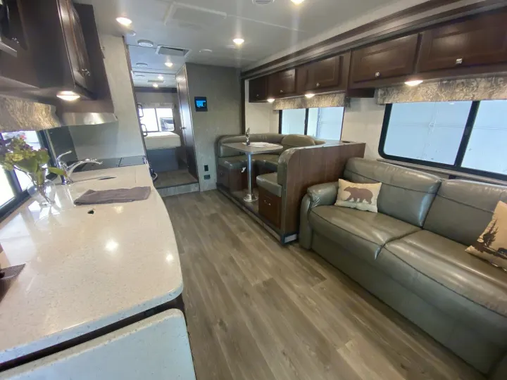Explore this spacious RV rental! Features a full kitchen, cozy dinette, and comfortable living area with a sofa.. Forester Forester Motorhome 2017