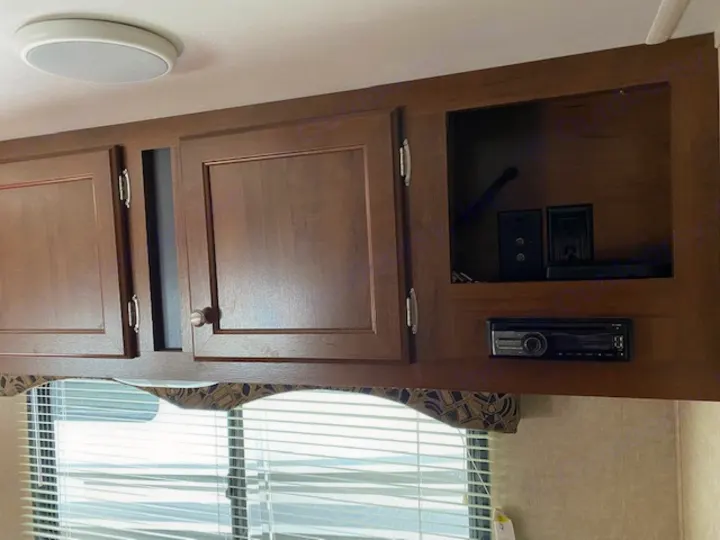 RV rental overhead cabinets with an integrated stereo. Practical storage & entertainment inside your RV.. prowler lynx 22LX 2015