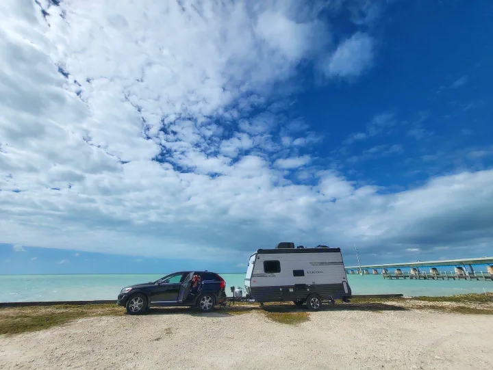 RV being towed by a Volvo XC60.. Coachmen Viking Ultra-Lite 16RBD 2019
