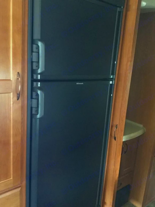 Dual Dometic refrigerators in an RV rental kitchen with wood cabinetry. Perfect for travel or camping.. Adventurer 31DS 2014