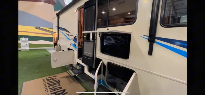This rv rental motorhome offers great outdoor features: its cream exterior, open storage bays, extended steps, and exterior TV.. Winnebago Vista 2019