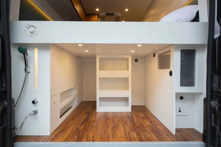 RV rental interior: Bunk bed, shower, storage, & power outlets in this modern camper van conversion.. Other Other 2021