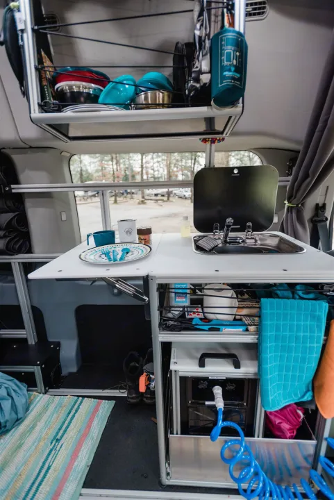 Removable Kitchen Pod with Faucet Sink and pressurized hot water tank with hose for outdoor shower runs off DC Power. . Ford Custom Transit 2019