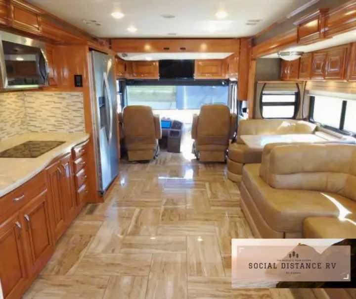 Step into luxury with this spacious rv rental, featuring a full kitchen, plush seating, and gleaming floors. Perfect for your next adventure.. Thor Motor Coach Venetian 2017