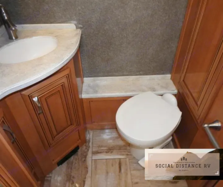 Your RV rental's clean and functional bathroom: sink, vanity, and toilet are visible in this interior shot.. Thor Motor Coach Venetian 2017