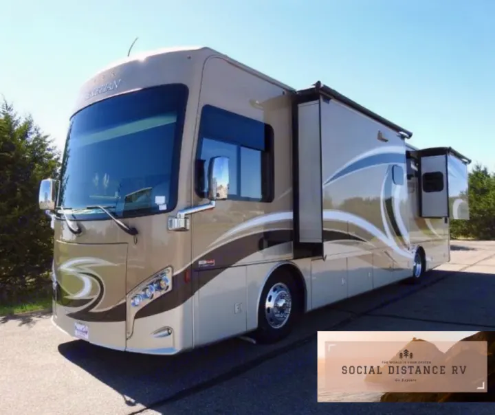A large, modern beige Class A motorhome with brown accents and extended slide-outs, an ideal rv rental.. Thor Motor Coach Venetian 2017