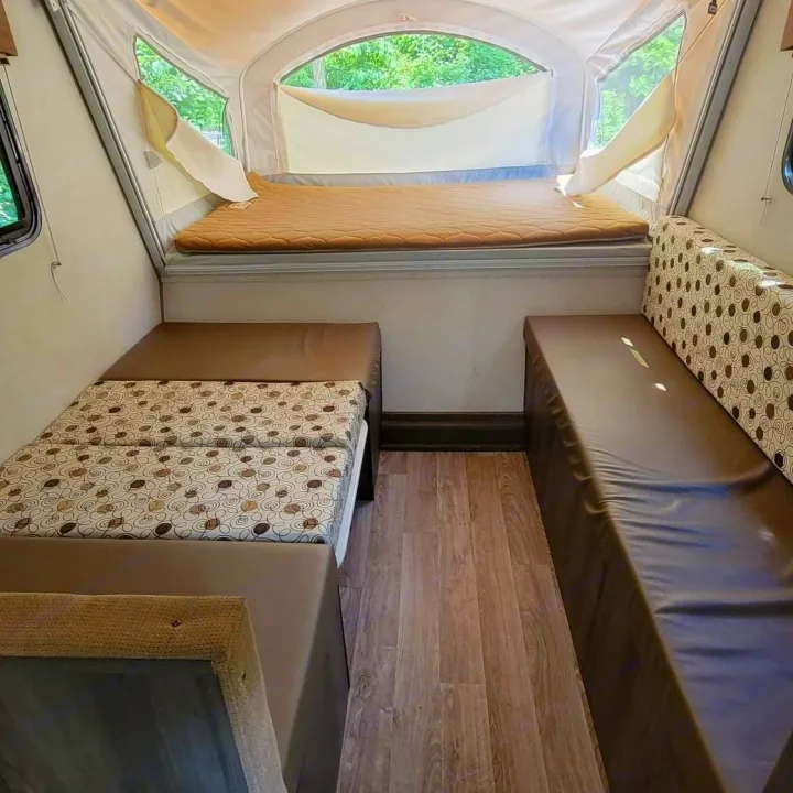 Inside this RV rental: a main bed, two side convertible beds/seating, and laminate floor. Compact and ready for adventure.. Forest River Other 2019