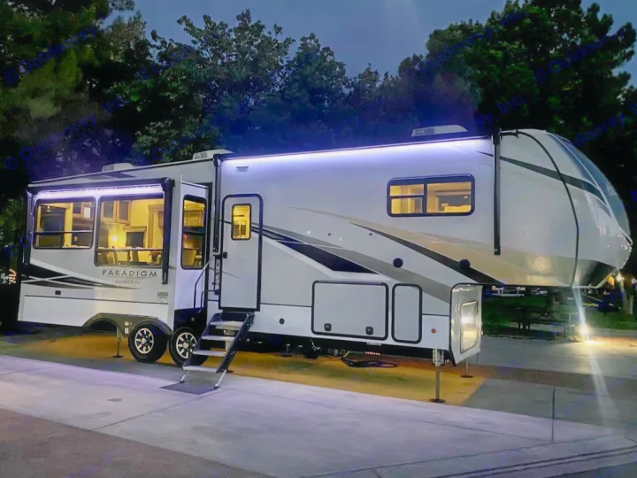 Beautiful, modern Alliance RV at night, exterior and interior lights glowing. Your ideal rv rental for a bright adventure!. Alliance RV Paradigm 2021