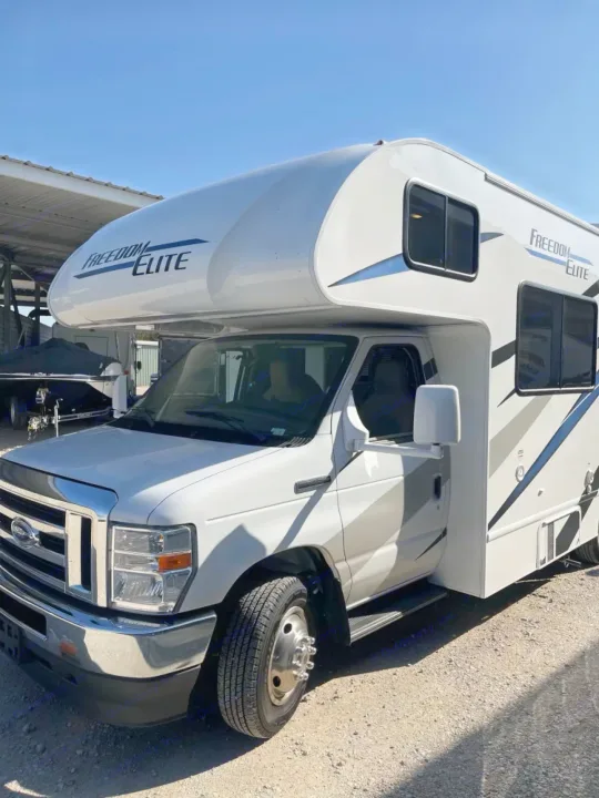 This white Freedom Elite Class C RV rental is ready for your next road trip.. Thor Freedom Elite 2021