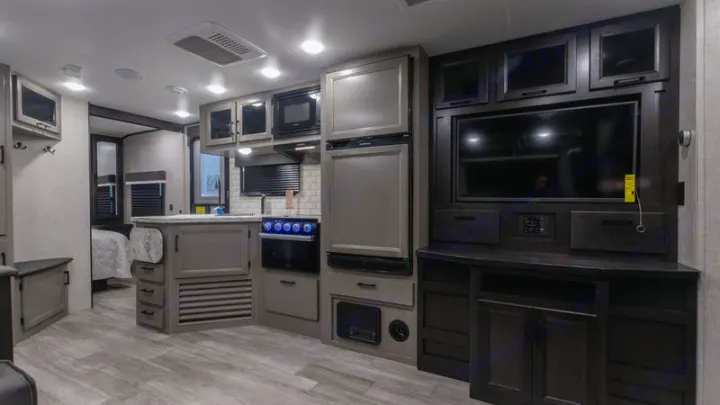 Spacious RV rental interior featuring a modern kitchen, entertainment area, and a cozy bedroom.. Jayco Jay Feather 2022