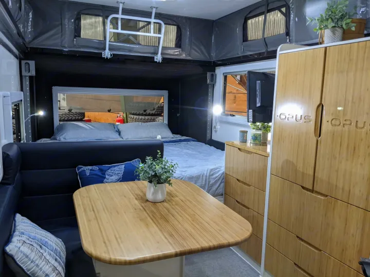This is a stock Opus photo of the inside sitting area and king bed in the back.. Other Other 2022