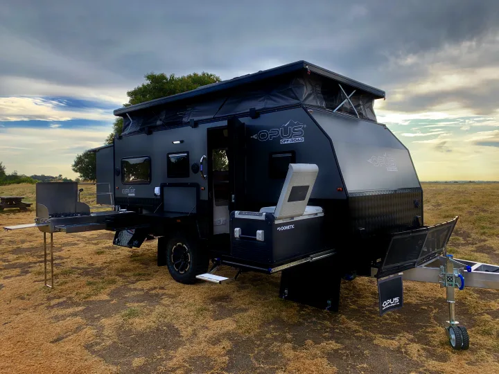 Explore the outdoors with this off-road OPUS camper. Featuring an outdoor kitchen and Dometic fridge, it's ideal for RV rental adventures.. Other Other 2022
