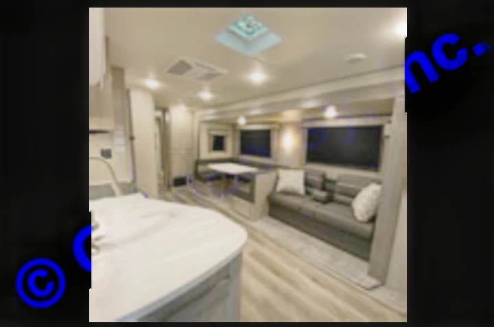 This spacious RV rental interior features a modern living area with kitchen, dinette, and sofa for travel adventures.. Coachmen Catalina 2022