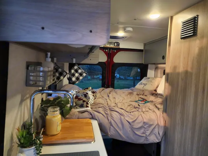 Experience van life! This rv rental offers a comfortable bed, compact kitchen, and storage for your road trip.. Winnebago Solis 2022