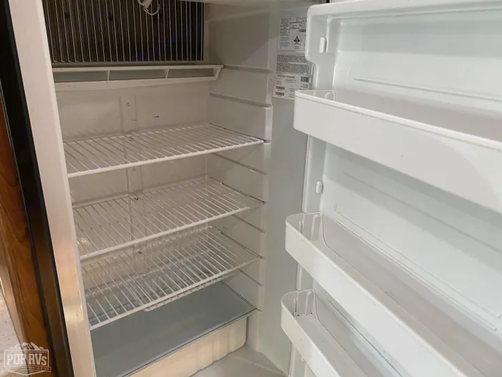 RV rental: Clean, empty refrigerator interior with wire shelves & door storage, ready for your trip.. Jayco Melbourne 2016