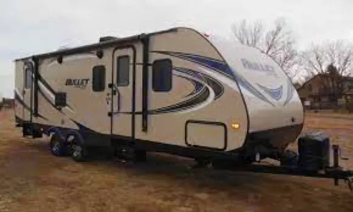 This light-colored travel trailer is a perfect RV rental option for camping and outdoor adventures. Spacious and modern.. Keystone RV Bullet Ultra Lite 2017