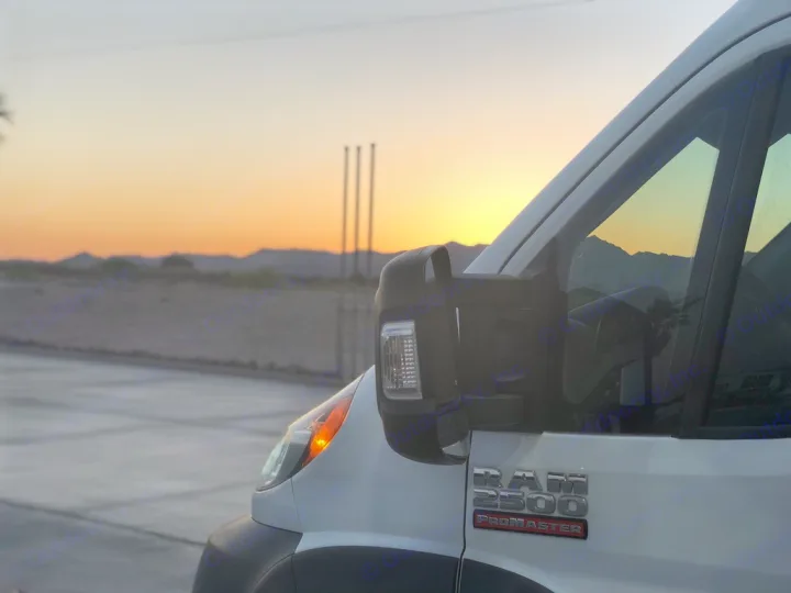 White Ram ProMaster van at sunset, ready for an RV rental road trip. Mountains visible in background.. Other Other 2016