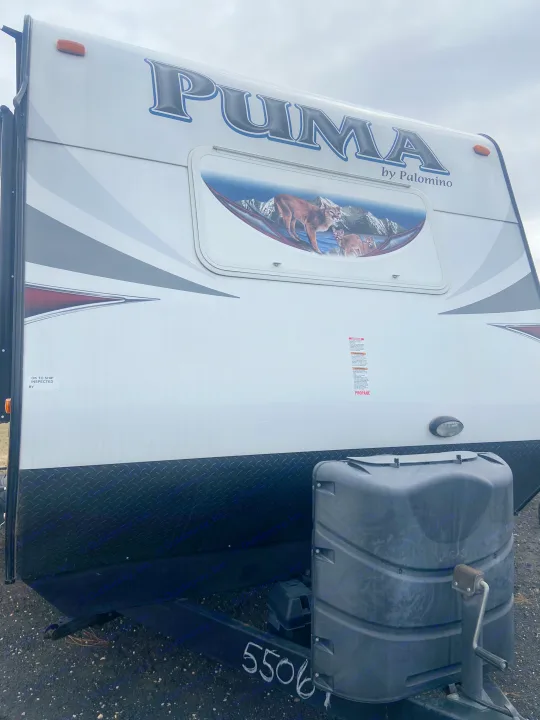 Front view of a Puma by Palomino travel trailer with cougar graphics. Ideal for your next rv rental adventure.. Palomino Puma 2015