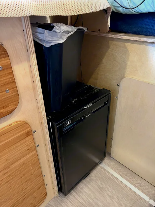 Compact Dometic refrigerator & trash can in an RV rental. Smart storage for a comfortable travel experience.. Mercedes-benz Sprinter 2016
