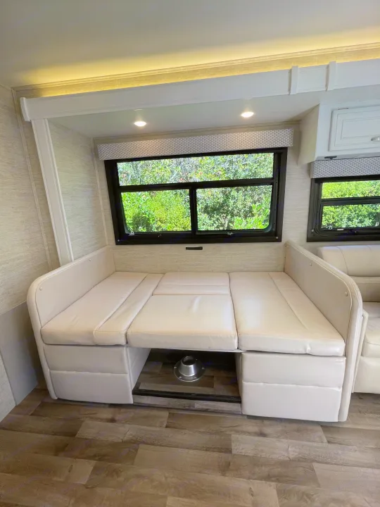 RV rental: Spacious, light-filled dinette converts to a comfortable bed, featuring large windows with scenic views.. Jayco Redhawk 2021