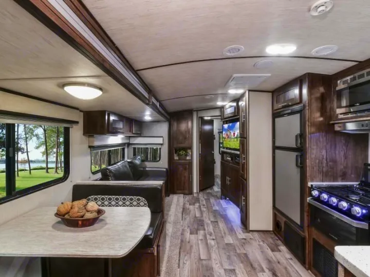 Spacious RV rental interior with kitchen, dinette, and living area. Perfect for comfortable travel.. Radiance Big Bear 2020
