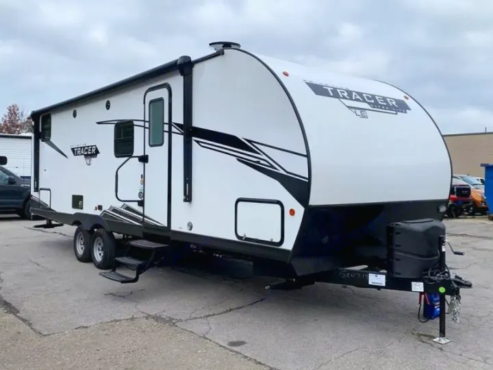 This white Tracer LE travel trailer (RV) is ready for rv rental. Perfect for outdoor adventures & camping.. Prime Time RV 260BHSLE 2022