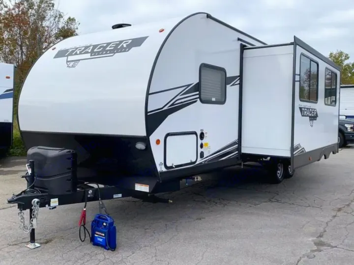 White Tracer travel trailer with extended slide-out. Ideal for your next RV rental or family camping trip.. Prime Time RV 260BHSLE 2022