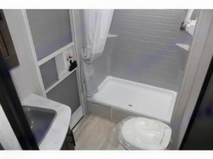 RV rental bathroom interior with sink, shower, and wrapped toilet, perfect for your next road trip.. Other Other 2021