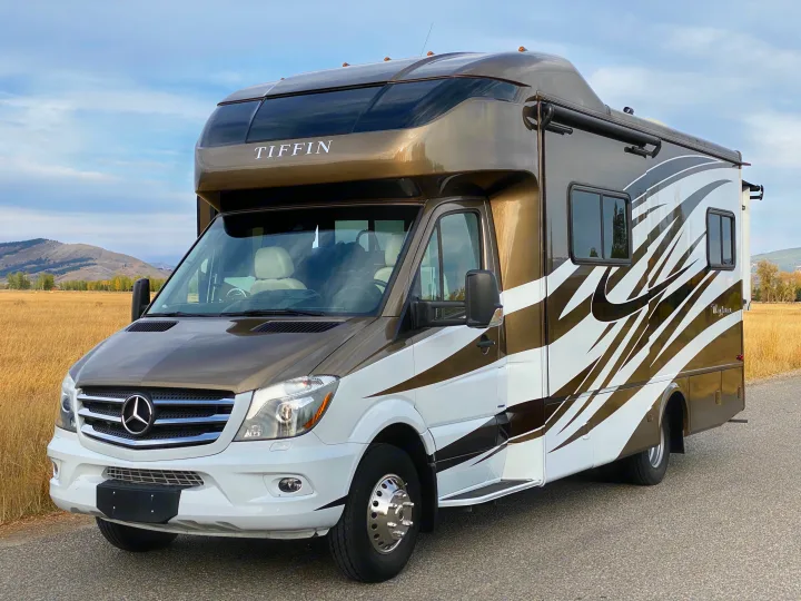 This Tiffin Wayfarer RV rental, a luxurious Mercedes-Benz motorhome, stands ready for adventure in a scenic landscape.. Wayfarer Wayfarer Motorhome 2017